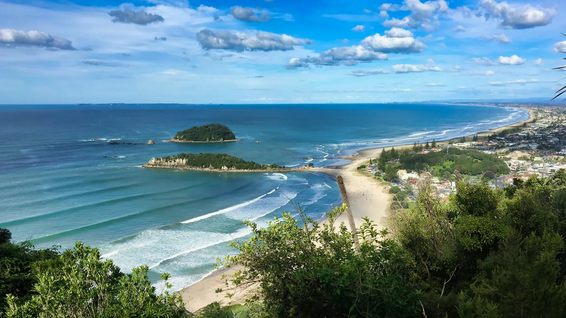 Mount Maunganui beach, Moturiki Island and the town seen from the top of Mauao
